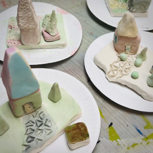 Mini ceramic houses made of clay.